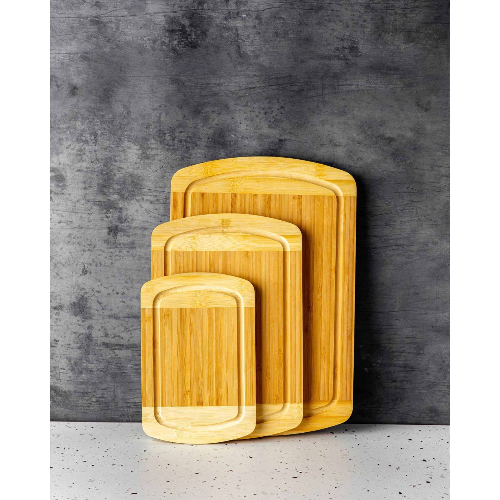 Bamboo cutting board with two-tone design and cut-out handles